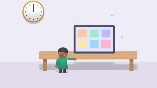 A child at a table with a screen of colourful tiles.